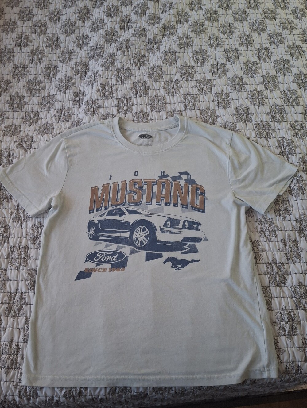 Ford Mustang Graphic Tee - Light Blue with Navy and Orange Print. Little Stain